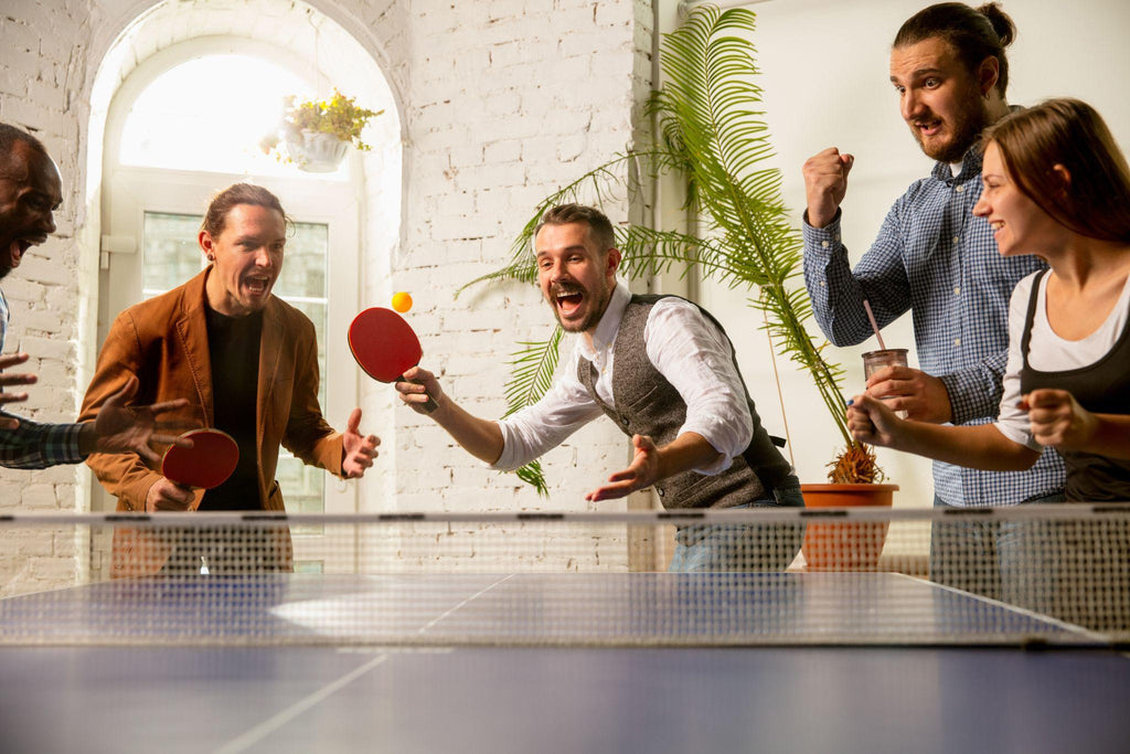 Group of friends playing ping pong