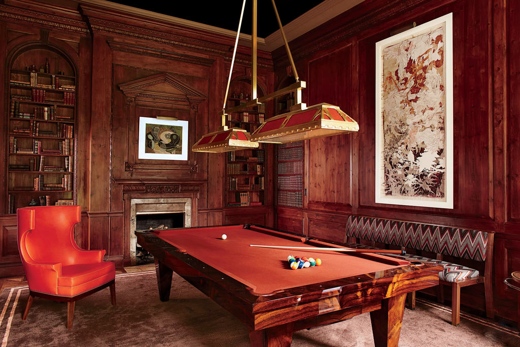 Luxury pool table light hanging over a custom pool table