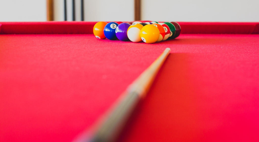 Pool billiard set, table with red cloth.
